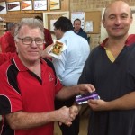 Tuesday 7th July 2015 : Club member David GArdiner presenting tonights winner Mike Galanty with a movie voucher