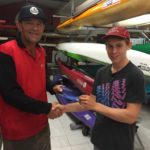 Tues 14th March 2017, Tom Green just back from winning medals at the Kayaking Nationals in Sydney presenting Doug Hodson with a movie voucher