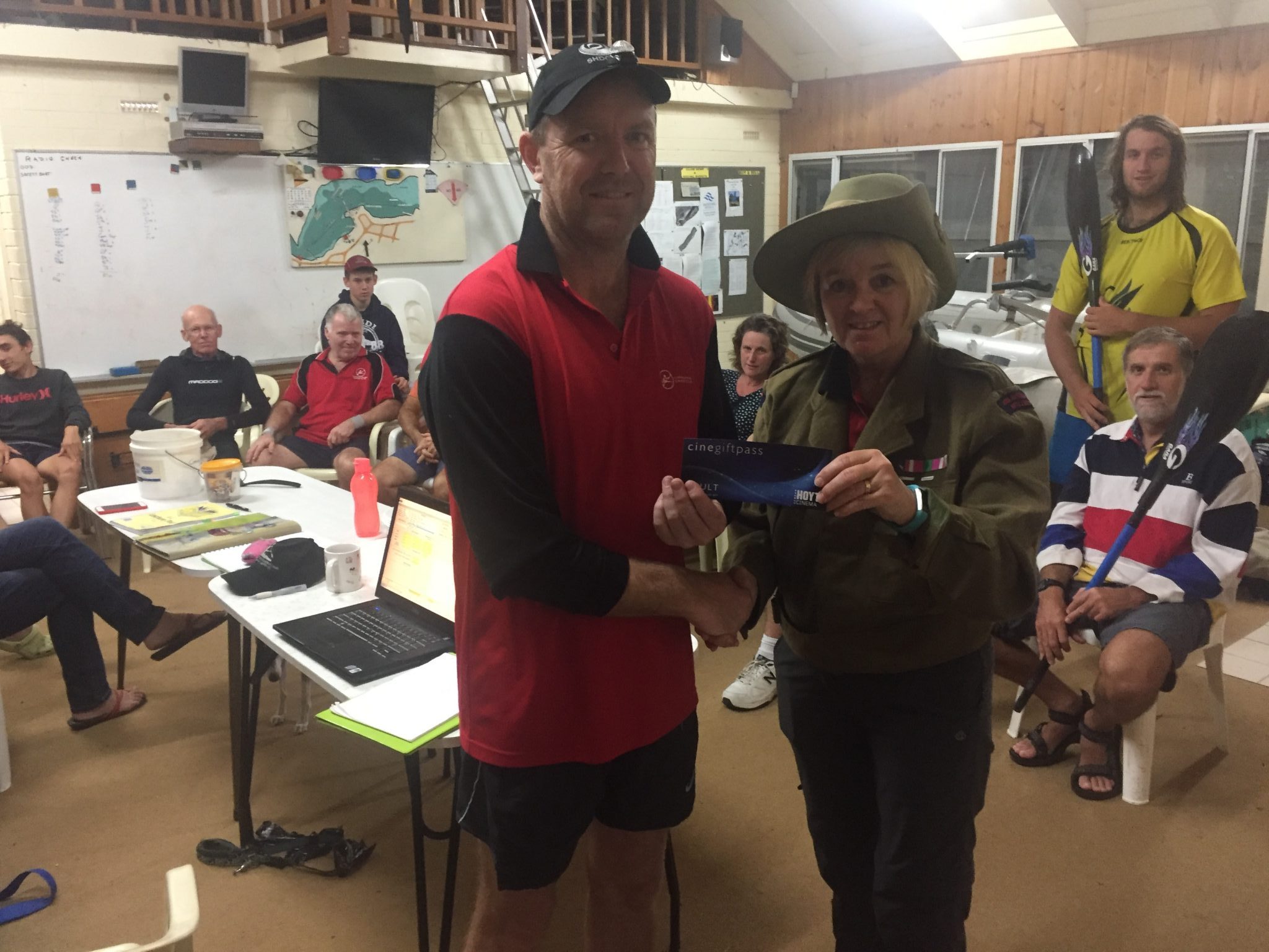 Tues 25th April 2017 Anzac Day Club Night : Tonight's photo shows Club Secretary Judith Thompson in her Anzac gear presenting Simon with a movie voucher.