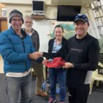 Tuesday 13th July 2021 : Tonight’s photos shows Club Treasurer David Urquhart presenting tonight’s winner Simon O’Sullivan a club cap with Steve and Cindy Coward the other hardy paddlers in the background.